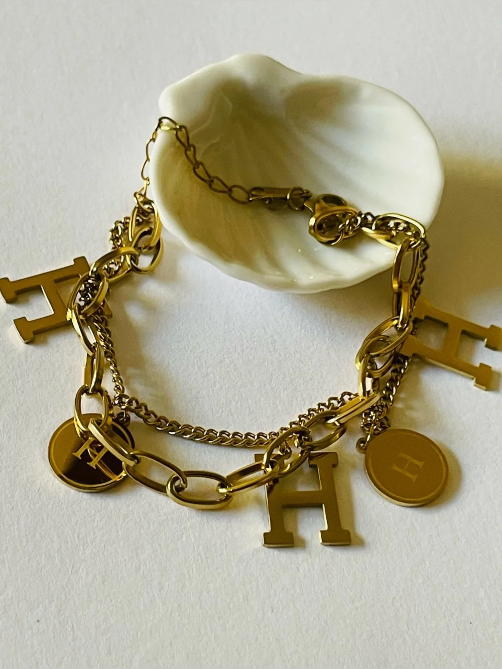Polished Gold H Charm Layered charm bracelet